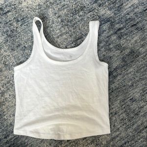 white tank, cuts off at waistline